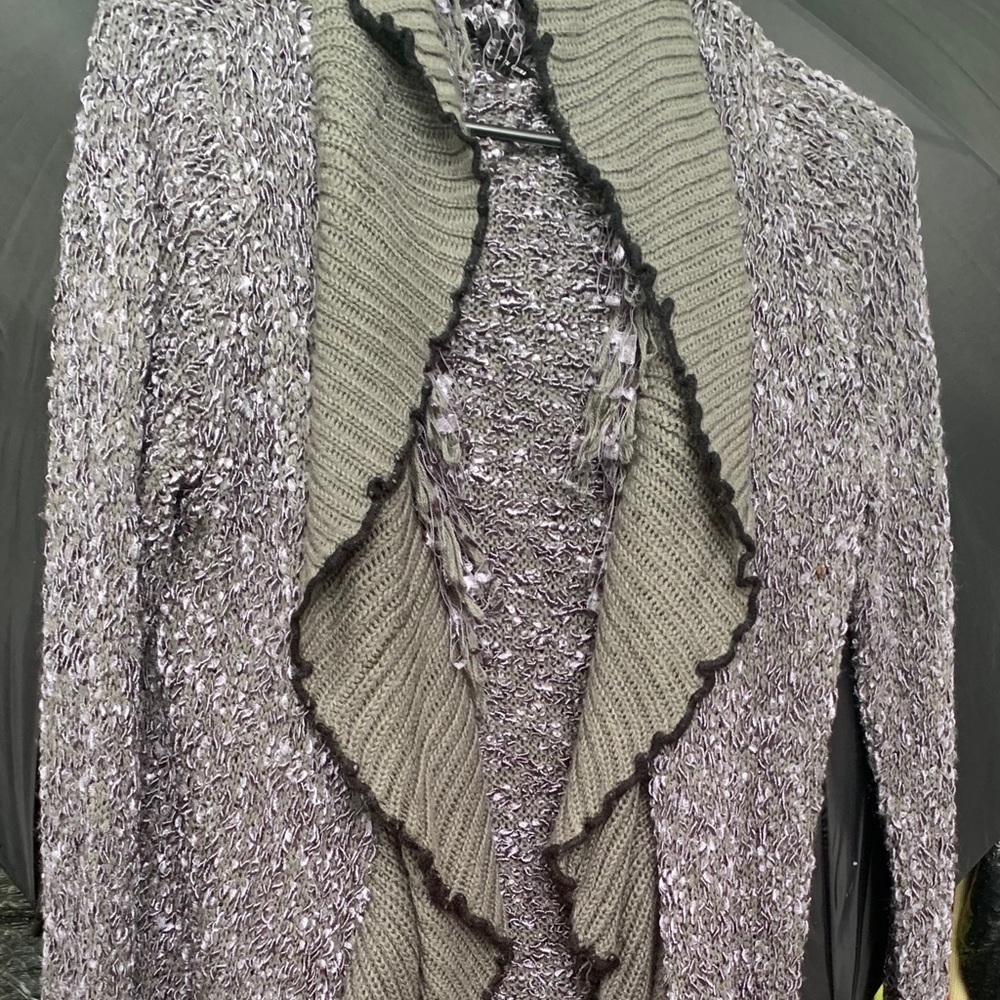 Ruffle and fringed cardigan.